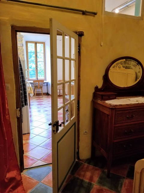 The door to the kitchen from bedroom 2.