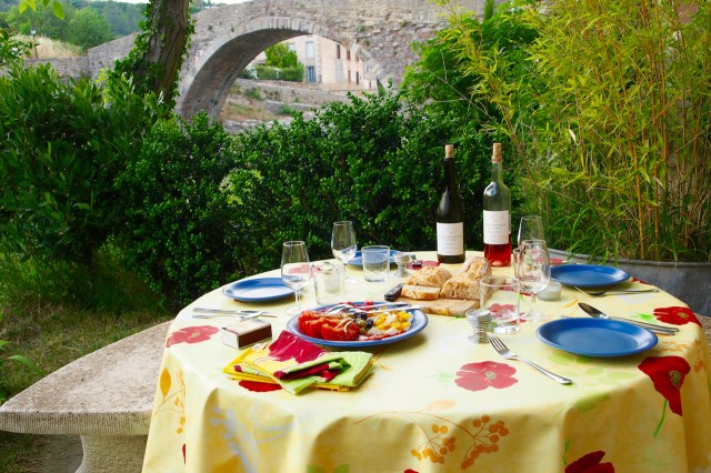 Stone table set for a meal.